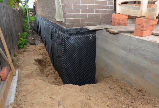 Happy homeowners after waterproofing job in Townley